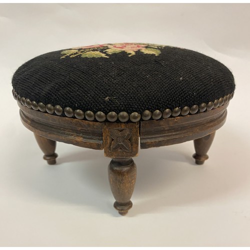 20 - Antique Needlepoint Circular Footstool Black With Floral Design. 29cm Diameter 18cm Height