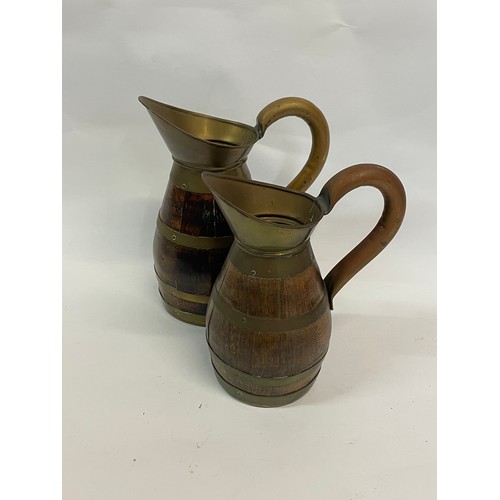 275 - 2 x Continental Metal Bound Wooden Wine Jugs
22 cms High (2)