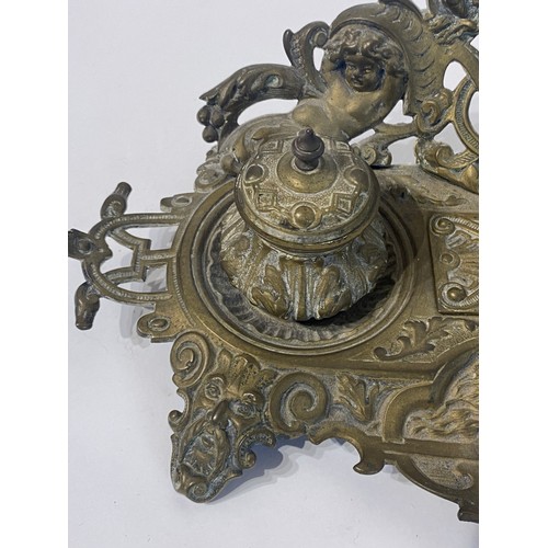 231 - Vintage Brass Art Nouveau Inkwell With Repousse of Faces and Cherubs. 32cm Length