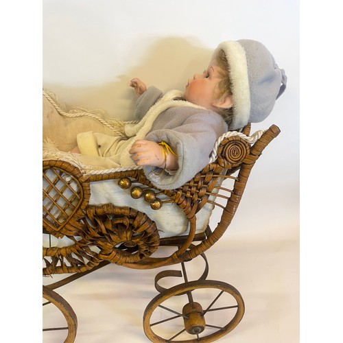 219 - Antique Style Doll Carriage Along With A Ceramic Doll.75 x 68 cms