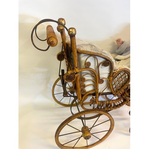 219 - Antique Style Doll Carriage Along With A Ceramic Doll.75 x 68 cms