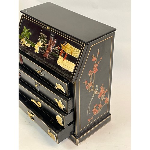 66 - Miniature Chinese Bureau  Decorated With Hardstone Figural Decoration And Drawers. 25 x 13 x 27 cms