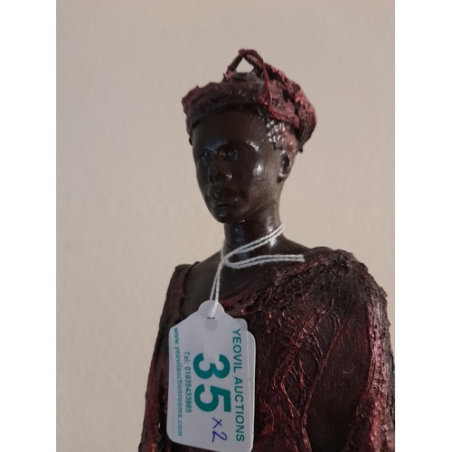 35 - 2 Large Mixed material figures of a man and woman, largest standing 67cm high