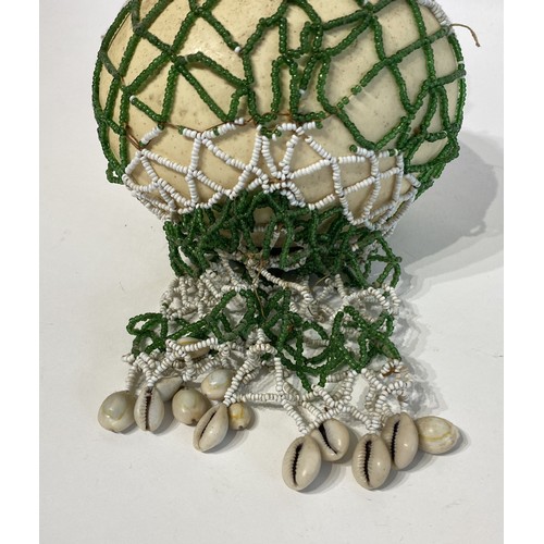 71 - Similar to Previous Lot. Antique Netted Ostrich Egg With Traded Bead Decoration.. 23cm x 16cm x 13cm