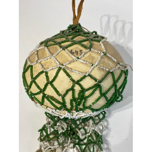 71 - Similar to Previous Lot. Antique Netted Ostrich Egg With Traded Bead Decoration.. 23cm x 16cm x 13cm