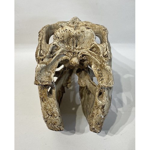 105 - Faux Dinosaur Skull . 39cm x 29cm x 17cm. No 2733