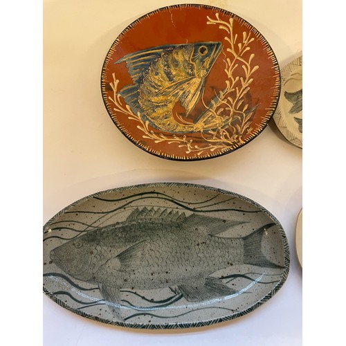 353 - Four Studio Pottery Plates Of Fish Design. Largest Plate 37.5 cms (4)