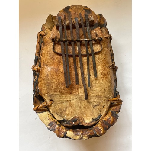 387 - Natural History:  Tortoise Shell Converted To A Finger Guitar Possibly Folk Art. 18 x 13 cms