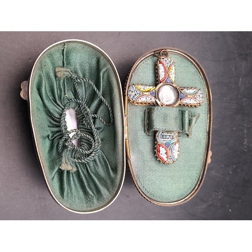 353 - An Egg Shaped Box of Mother of Pearl opening up to reveal a Micro Mosaic Cross with Brass Back 5cm l... 