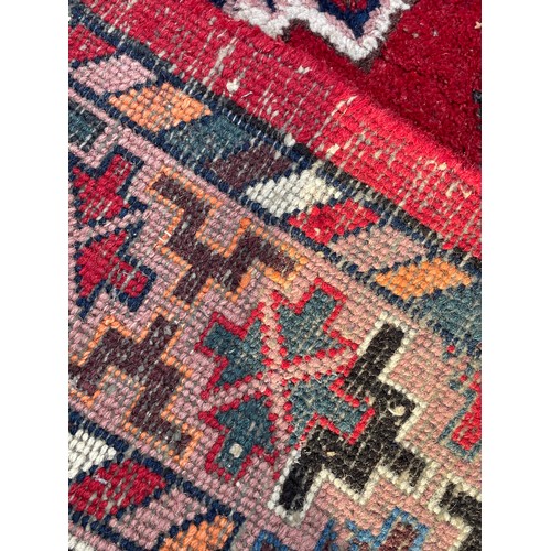 83 - Large Decorative Hand Made Ground Rug. 340 x 248 cms