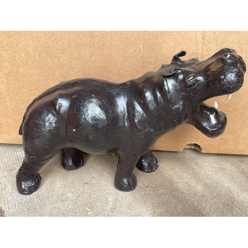 630 - A Leather Clad Hippopotamus Figure . 33 x 23 cms