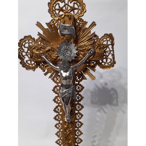 4 - A gilt Corpus Christie on wood cross with metal decor mounted on a gilt finished plaster base, 47cm ... 