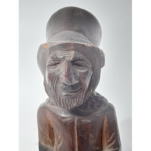 22 - Vintage folk art carved hardwood figure of an old man  A/f 17cm