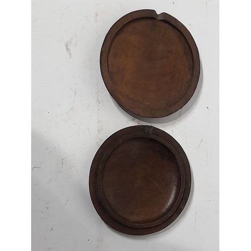 30 - Circular wooden box, profusely carved to both sides, 12cm diameter