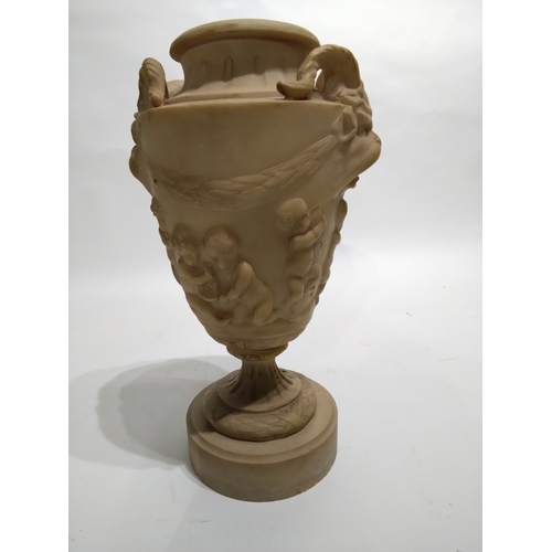 199 - A Composite Vase / Urn With Putti And Grotesque Handles , 37cm high