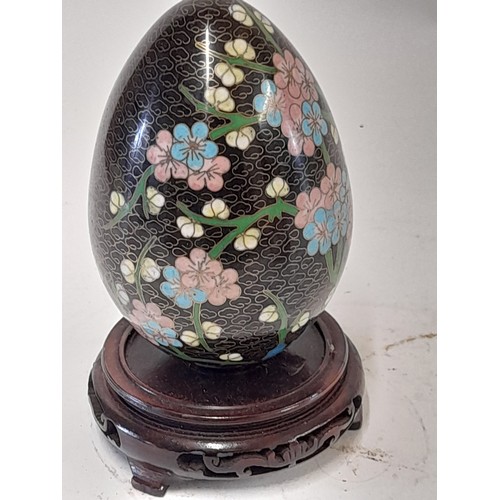 112 - Oriental Cloisonné Style  Egg on wooden stand , 18cm high