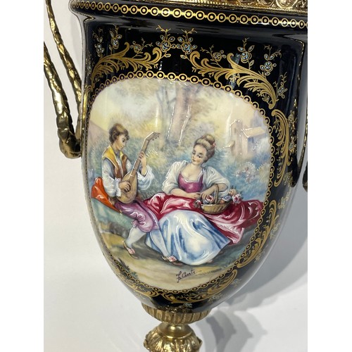 309 - A Pair of Serves Marked Porcelain Urns 43cm high with romantic scenes on each