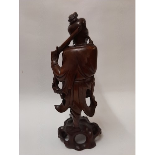 220 - Chinese Root Carving of a Fisherman carrying a Carp, 44cm high