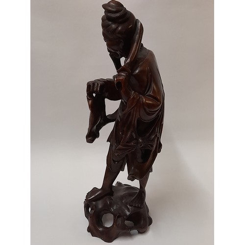 220 - Chinese Root Carving of a Fisherman carrying a Carp, 44cm high