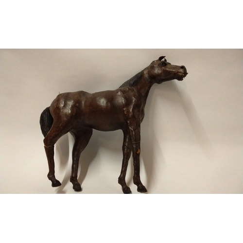 257 - Vintage leather clad decorative horse, 31cm High x 33cm long