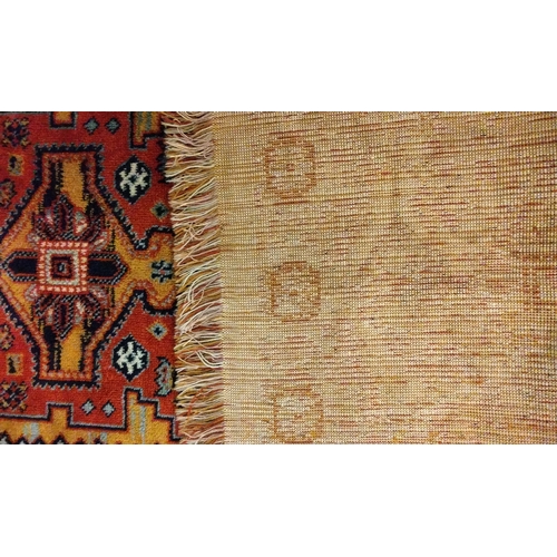 138 - Red ground Rug 137cm x 69