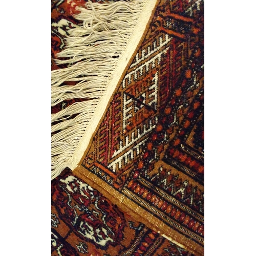 143 - Brown ground Rug hand knotted, 148cm x 94cm