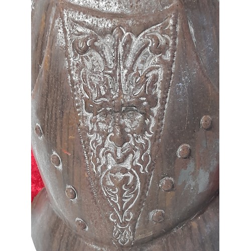 700 - Metal Breast Plate with Greenman design mounted on wooden plaque, total size 40cm x 28cm