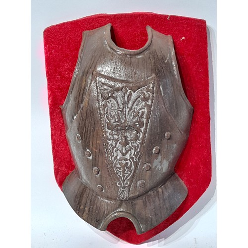 700 - Metal Breast Plate with Greenman design mounted on wooden plaque, total size 40cm x 28cm