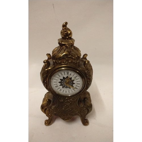 740 - Hand wound table clock-mercedes, 21cm high x 11cm wide.