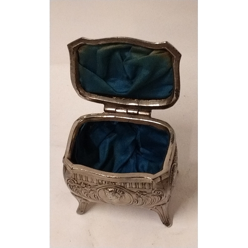 671 - Metal trinket box/casket on legs with blue lining, 10cm high x 9cm wide x 6cm deep