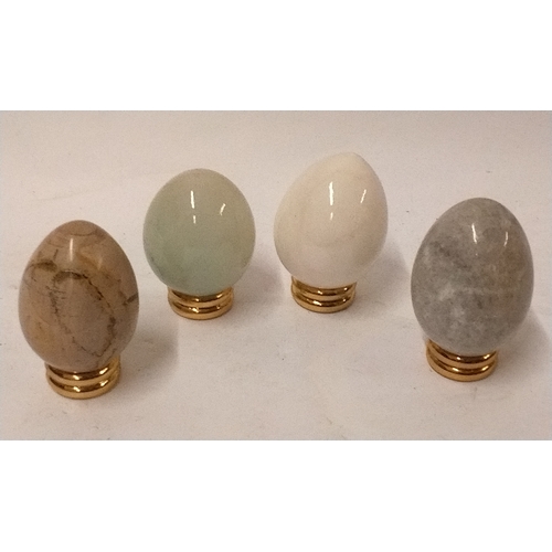 674 - 4 x polished stone eggs on stands approx 9cm high