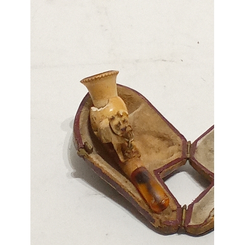 696 - Small Antique meersham pipe with a seated dog a top of bowl in leather case 8cm x 4cm