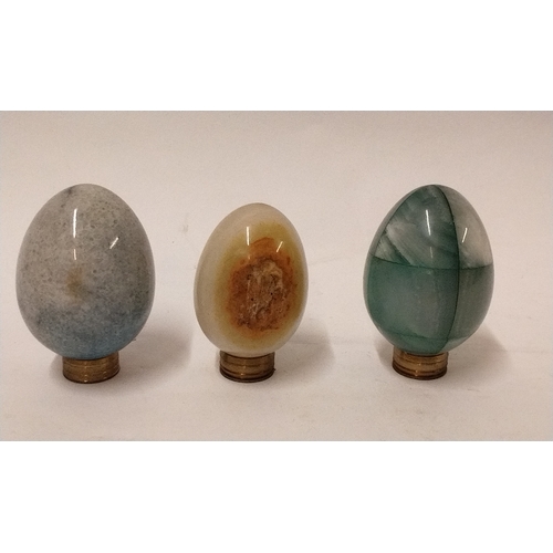 780 - 3 x egg shaped ornaments made from various rock, tallest 8cm