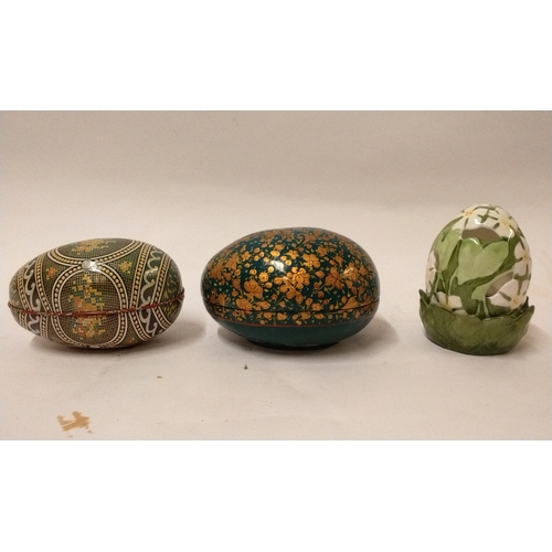 781 - 2 x decorated eggs, 1 made of tin the other papier mache Along With  a ceramic egg shaped tea light ... 