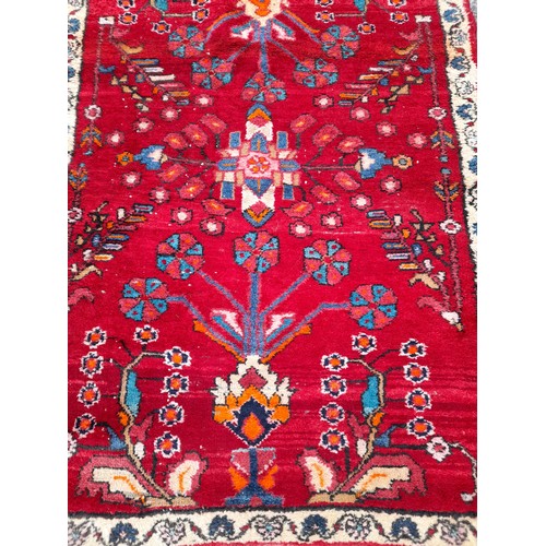 79 - Hand Tied Decorative Red ground Rug with Floral Design 146cm x 104cm