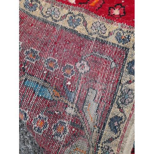 79 - Hand Tied Decorative Red ground Rug with Floral Design 146cm x 104cm