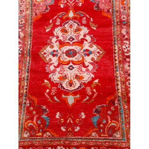 89 - Hand Tied Red ground rug with Floral Design, 152cm x 102cm