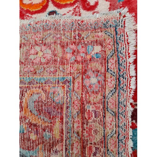 89 - Hand Tied Red ground rug with Floral Design, 152cm x 102cm