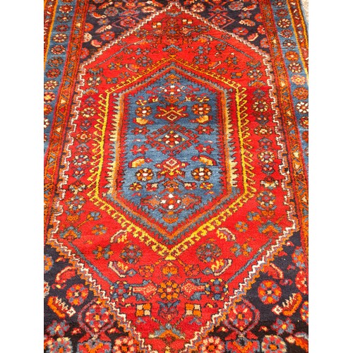 91 - Hand Tied Blue and red ground Rug with central Diamond Pattern, 202cm x 135cm