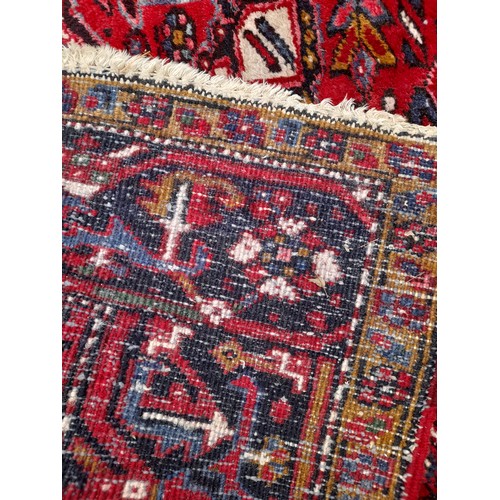 92 - Large Hand Tied Red Ground Rug with Signs Of  Wear, 325cm x 241