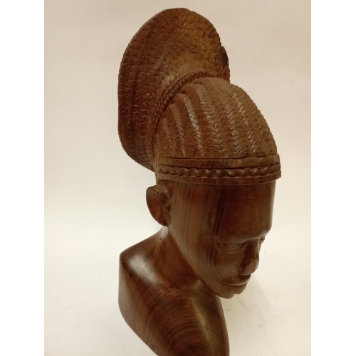 175 - Carved hardwood bust of a African boy with head dress 31cm high