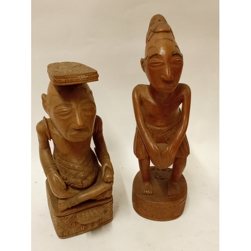 176 - Two carved hardwood  tribal figures tallest 32cm high