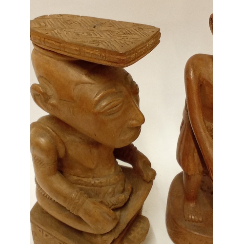 176 - Two carved hardwood  tribal figures tallest 32cm high