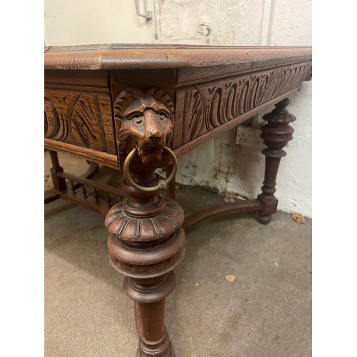 25 - French Table With Carved Lion Head Decoration. 128 x 100 x 73 cms