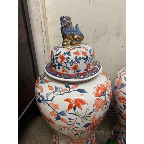 320 - A Good Large Pair Of Chinese Lidded Urns With Foo Dog Finials To Lids Along With Mark To Base.