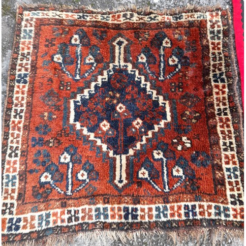 99 - 2 x small Rugs, 1 x Red ground with stylised pattern, 153 x 181 and 1 x Brown ground, 72cm x 75cm