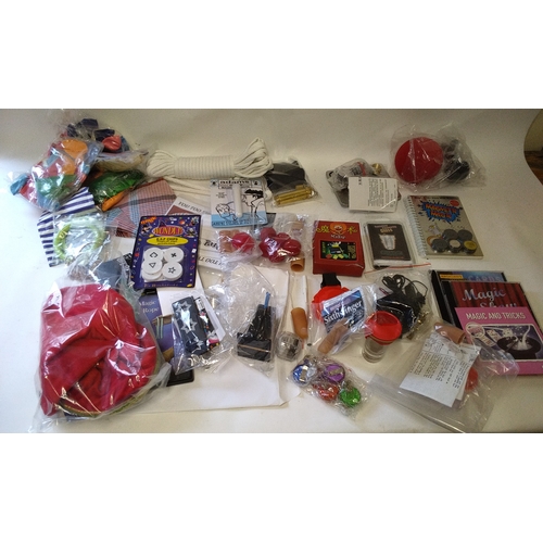 37 - Large quantity of magic tricks and instructions, contents of a box and suitcase