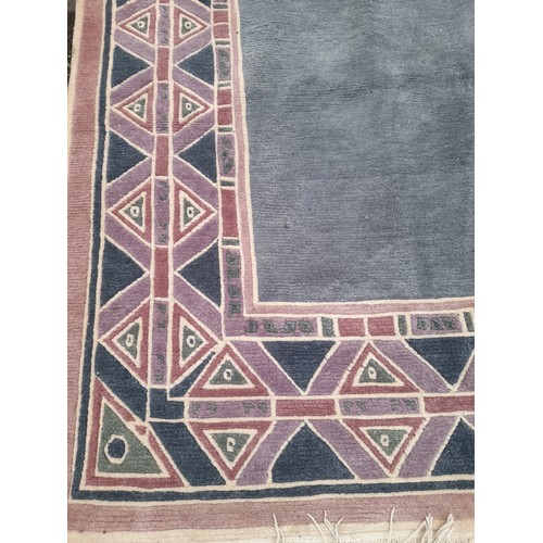 51 - Large Blue ground wool Rug with Geometric design to border, 400cm x 297cm