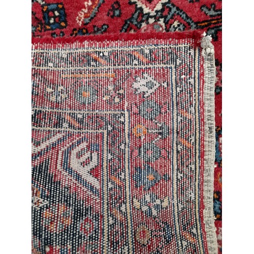 53 - Red ground Rug hand knotted, 210cm x 133cm