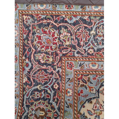 54 - Red Ground Rug with Blue central Diamond design, 228cm x 145cm